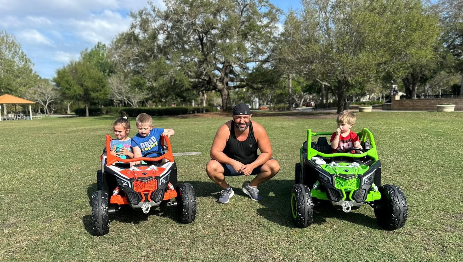Zied Ben Taleb poses with children riding in the remote control cars available at his business, Fun Florida ZBT, LLC. Ben Taleb was able to start this business with support from EAF and our partner, Gulf Coast JFCS. (Courtesy of Gulf Coast JFCS)