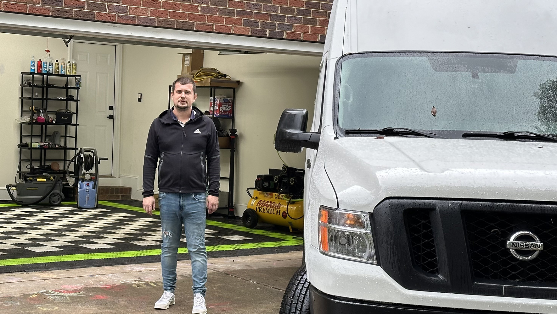 Petro Heinovych, who worked with EAF and our partner CRRA to get his car detailing business up and running, stands outside his workshop. (Courtesy of Petro Heinovych)